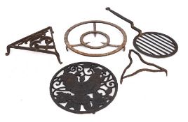 A circular grid iron:, 30cm diameter, a triangular brandreth,