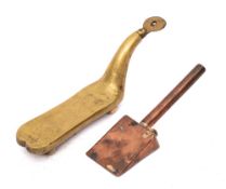 A brass coconut desiccator:, 22cm long, also a copper icing smoother of wedge shape.