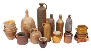 A mixed group of kitchen ceramics:, comprising stoneware bottles and ewers, a comfit pot,
