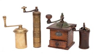 A brass cylindrical spice grinder: with detachable handle, 23cm high, a brass cylindrical grinder,