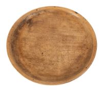 A circular sycamore tray or platter:, 44cm diameter, 17th/18th Century.