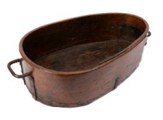 A large wooden trough: of pear-shaped outline with iron twin handles - the trough 56 x 38cm maximum,