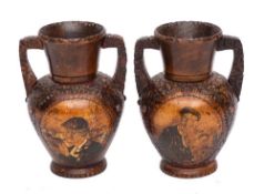 A pair of carved wood twin-handled candle stands: of urn shape,