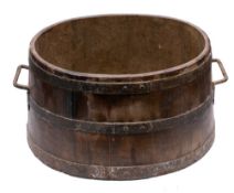 A late 19th Century iron coopered twin-handled milk settler: of oval shape and large size,