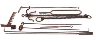 A collection of metalwares: to include a wrought iron pot hook, an open slice, skewers, rake, etc.