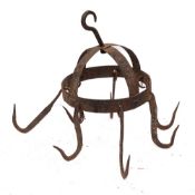 An iron 'Dutch Crown' banded game hanger: with seven hooks, 24cm diameter.