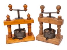 A 19th Century maple and beechwood fruit press: with central screw thread and tin pan base,