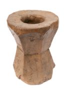 A 19th Century rustic wooden mortar: with polygonal angled sides.