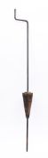 A Pyrenean iron and wood hand driven cake spit: with wood and metal bound central cone.