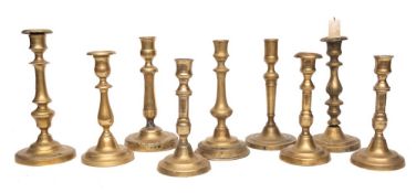 Nine various 19th Century brass candlesticks:.