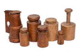 Six various turned wood pie moulds: and a small wood lidded jug of tapering form, 23cm high.