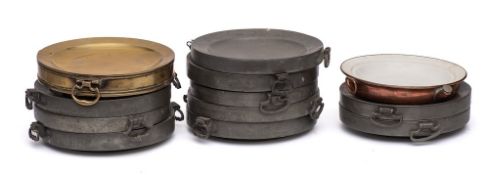 Ten pewter circular twin-handled hot water plates:,