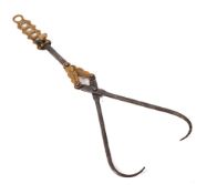 An iron and brass adjustable height patent meat scissor hook: with engraved decoration, 45cm.