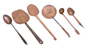 Three copper and metal skimmers:, a copper and metal handled hanging spoon, a copper ladle,