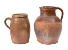 A ribbed terracotta ewer: of oviform shape, 30cm high,