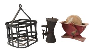 A stone knife grinder: in an iron table stand with turned wood handle,