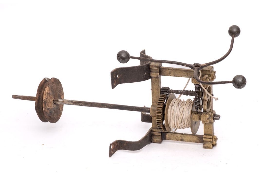 A rare 17th Century brass and iron English spit engine: with three branch governor wheel,