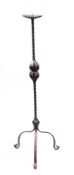 A wrought iron pricket candle stand: in the 17th Century taste,