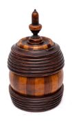 A lignum vitae biscuit barrel and cover: with acorn finial,