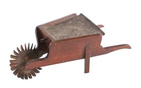 A 19th Century oak flour dispenser: in the shape of a wheelbarrow,