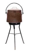 A large 19th Century copper cooking pot and cover: of tapering form with iron loop handle,