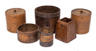 Two half gallon grain measures with covers:, 15cm high, a drum-shaped metal bound grain measure,