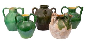 Three French green and yellow slip glazed olive oil jars: with pouring spouts,