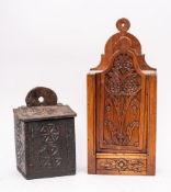 A 19th Century Continental candle box: with shaped elevating front cover carved with flowerheads