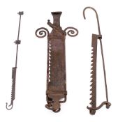 Three iron adjustable pot hooks: of graduating size.