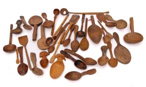 A collection of treen spoons and ladles:.