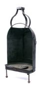A 19th Century tin hastener: of semi circular outline with metal tray at base and door to the rear,