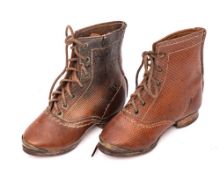 A pair of child's leather boots: with lattice design.