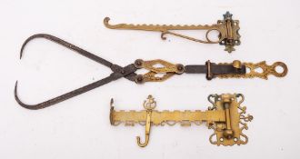 A 19th Century brass and iron patent scissor jack:, also two brass chimney crane hooks.
