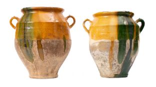Two French pottery twin-handled comfit jars: with ochre and green slip glazed decoration, 28.