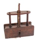 A 19th Century oak drop weight mousetrap:, of rectangular shape with elevating block, 19.5cm long.