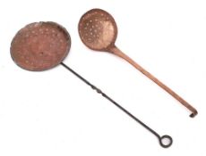 A copper hanging skimmer: with engraved floral foliate decoration and handle with hooked end,