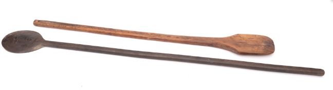 Two wood cauldron stirrers: with turned handles.