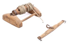 A butcher's pig hoist: with rope attached barrel and separate iron mounted beam, 55cm wide.