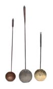 A copper and iron handled hanging ladle:, 94cm long,