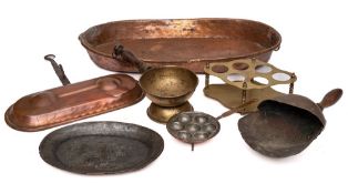 A 19th Century oval copper fat catcher:, 59cm long, a copper and tinned egg pan with iron handle,