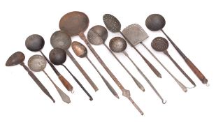 An iron long-handled hanging ladle: with brass banded inlaid handle together with a collection of