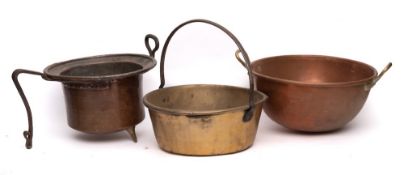 A copper and brass twin-handled deep circular bowl:, 41cm diameter,