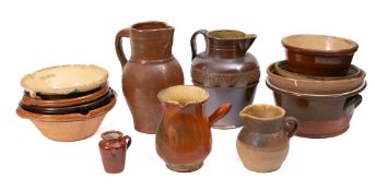 Four small terracotta single lipped dairy bowls:, four other bowls,