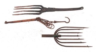 An iron eel fork: with seven tines,