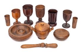 Five various treen goblets:, a small fruitwood circular twin-handled bowl and cover,