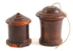 A 19th Century lignum vitae drum-shaped string box: with ribbed cover and octagonal base, 13cm high,