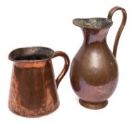 A 19th Century copper pitcher: of baluster shape with open scroll handle, 42cm high,
