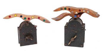 Two tin clockwork mechanical bird scarers: with mirrored and coloured wings.