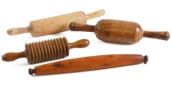 A 19th Century yew-wood turned rolling pin: of elongated form, 40cm long,