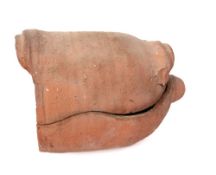A terracotta salting crock: and twin-handled ribbed cover (for salting ham), 28cm long.